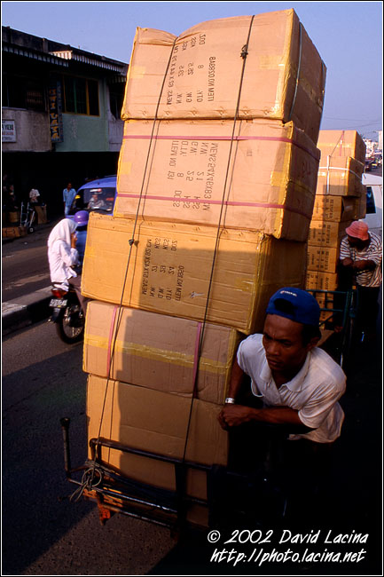 transporting goods on bike - Kerinci, Indonesia